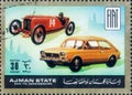 Saint Petersburg, Russia - March 06, 2020: Postage stamp issued in the Ajman with the image of old and antique Fiat cars, circa