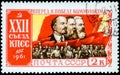 Saint Petersburg, Russia - March 15, 2020: Postage stamp issued in the Soviet Union with the image of Workers and banners with Royalty Free Stock Photo