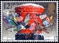 Saint Petersburg, Russia - March 21, 2020: Postage stamp issued in the United Kingdom with the image of The Christmas Post, pillar