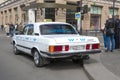 Old taxi car `Volga` GAZ-3102 waiting for passengers