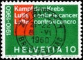 Saint Petersburg, Russia - May 17, 2020: Postage stamp issued in the Switzerland dedicated to the Fight against cancer.