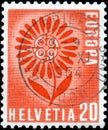 Saint Petersburg, Russia - May 05, 2020: Stamp issued in Switzerland with the image of the Stylized flower of 22 leaves Royalty Free Stock Photo