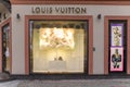 Show window of Louis Vuitton fashion store, decorated in Christmas style with bright Royalty Free Stock Photo