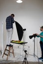 Food photography lesson in a photo studio, a student makes a flat lay