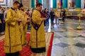 Russian Orthodox priest in traditional clothing serving in the Saint Isaac`s Russian Orthodox Cathedral in Saint Petersburg Russi