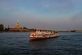 Tourist boat on the river. Evening navigation on the Neva River, in St. Petersburg