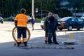 workers lay an internet cable on the street