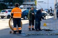 workers lay an internet cable on the street