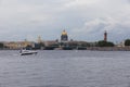 Small speed boat on Neva river. Peter and Paul Fortress on a grey cloudy day