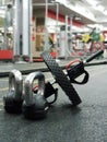 SAINT-PETERSBURG, RUSSIA:Sports equipment. Roller gymnastic and black kettlebell on the floor at the WorldClass sports club at Royalty Free Stock Photo