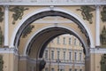 Triumphal Arch of General Staff Building with white columns and bas relief sculptures of angels on Palace Square