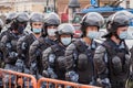 Saint Petersburg, Russia: young Russian national guardsmen in disposable masks cordon the space of a protest rally