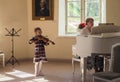Saint-Petersburg. Spring 2017. Little girl musician plays the violin. Royalty Free Stock Photo