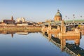 The Saint Pierre Bridge and the dome of the La Grace Hospital reflecting in the Garonne, Toulouse.