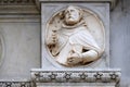 Saint, relief on the portal of the Cathedral of Saint Lawrence in Lugano