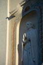 saint sculpture praying on historical church wall