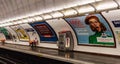 Saint Sebastien. Parisian subway station with passenger and advertising posters