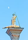 Saint Theodore at the San Marco, Venice, with the moon in the background Royalty Free Stock Photo