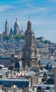 The Saint Trinity church and Sacre Coeur basilica in the background, Paris, France. Royalty Free Stock Photo