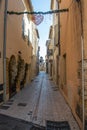 Saint Trope narrow street with plants Royalty Free Stock Photo