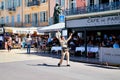 Saint-Tropez, France - September 22, 2018: Street in the old part of the city full of tourists and policeman