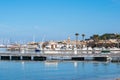 Saint Tropez view from far away with palm trees water and blue sky