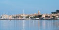 Saint Tropez view from far away with palm trees water and blue sky