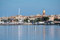 Saint Tropez view from far away with palm trees water and blue sky