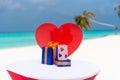 Saint Valentine\'s day celebration gifts decorated on the table at the tropical beach