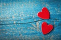 Saint Valentines day greeting card. Red hearts on blue wooden table top view.