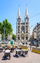 The Saint-Vincent de Paul church at the top of La Canebiere and a cafe terrace in Marseille, France Royalty Free Stock Photo