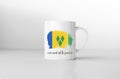 Saint Vincent and the Grenadines flag on white coffee mug.