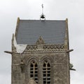 Sainte-Mere-Eglise, FRA, France - August 21, 2022: DDAY Memorial with Paratrooper on bell tower Royalty Free Stock Photo