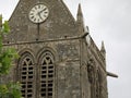 Sainte-Mere-Eglise, FRA, France - August 21, 2022: DDAY Memorial with Paratrooper on bell tower Royalty Free Stock Photo