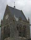 Sainte-Mere-Eglise, FRA, France - August 21, 2022: DDAY Memorial with us Paratrooper on bell tower Royalty Free Stock Photo