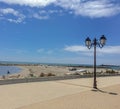 Camargue, France  retro streetlamp on promenade with beach background Royalty Free Stock Photo