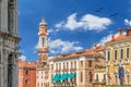Saints Apostles Bell Tower With Old Clock In Venice - Italy With Colorful Blue Sky And White Clouds