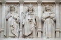 Saints Dominic, Louis and Francis of Assisi, statue on the facade of Saint Augustine church in Paris Royalty Free Stock Photo
