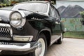 olga, third series model, close-up view of headlight and front of the car, luxury old black car