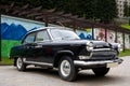 Volga, third series model, luxury old black car on a street in Sairme, health mountain restort in Georgia