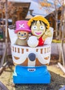 Vintage manga character rides featuring the One Piece pirates sailing on their Going Merry ship. Royalty Free Stock Photo