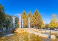 Ancient Greek or Roman style columns used as fountains in the Chichibu Muse Park in autumn.