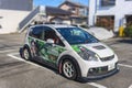 Japanese itasha car decorated by a vinyl wrap illustration of manga and anime idol character.