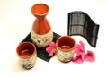 Sake set with flowers Royalty Free Stock Photo