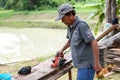 Sakon Nakhon, Thailand - August 6, 2019 : Carpenter Using Electric Sander for wood, Carpenter working on construction