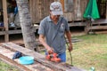 Sakon Nakhon, Thailand - August 6, 2019 : Carpenter Using Electric Sander for wood, Carpenter working on construction