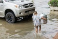 SAKON NAKHON, THAILAND - JULY 29, 2017 : Boy walking with water Royalty Free Stock Photo