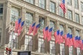 Many flags on the facade of The Saks Fifth Avenue department store in Midtown Manhattan in New York,USA Royalty Free Stock Photo