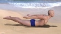 Salabhasana pose yoga man beach