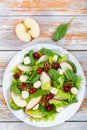 Salad of apple, spinach, mini mozzarella balls, lettuce leaves, Royalty Free Stock Photo